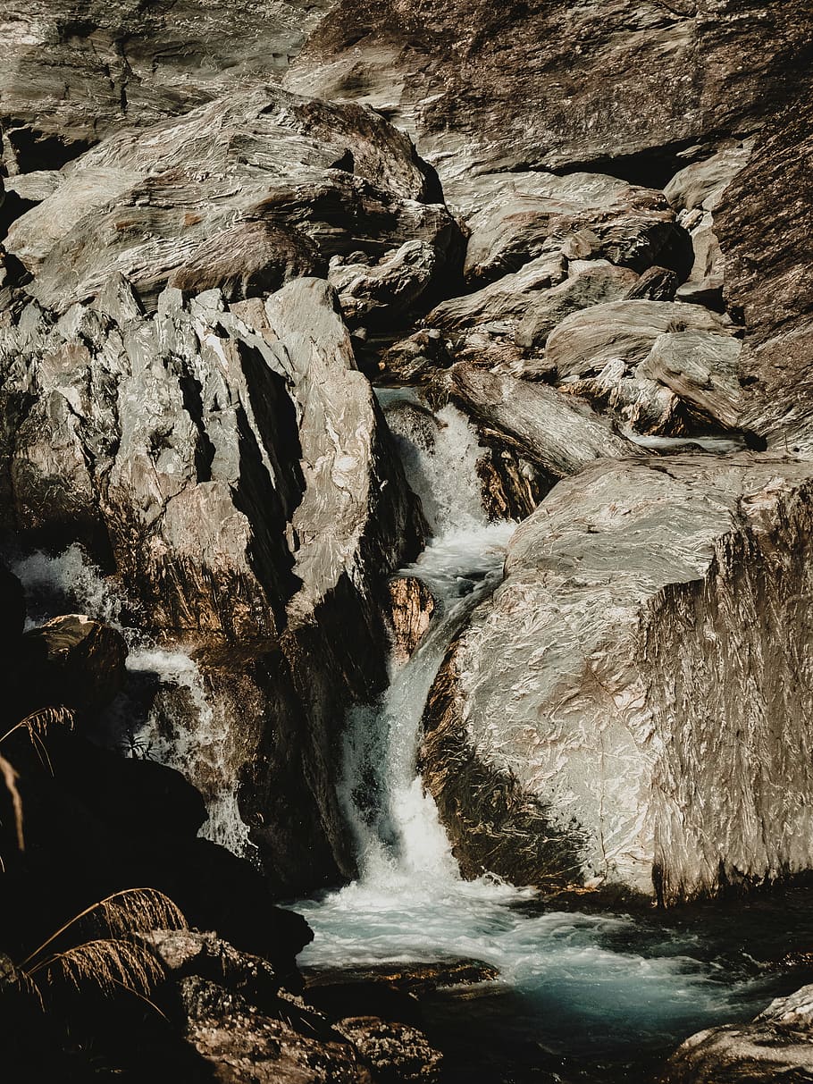 river and gray rocks, photography of waterfalls and brown stone HD wallpaper