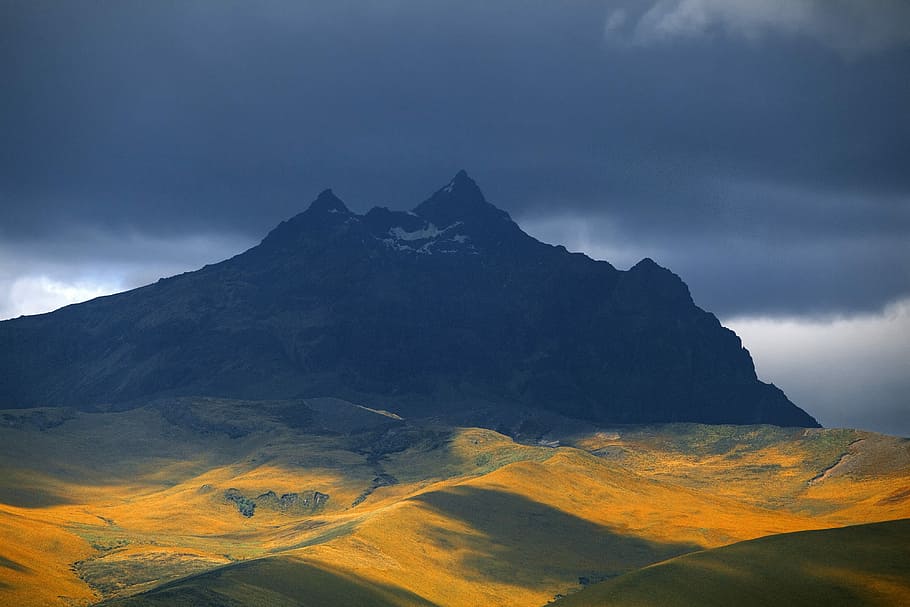 black mountain under gray clouds, mountain under cloudy sky, shadows HD wallpaper