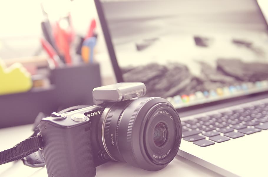 black Sony camera body near MacBook Pro, keyboard, apple, input HD wallpaper