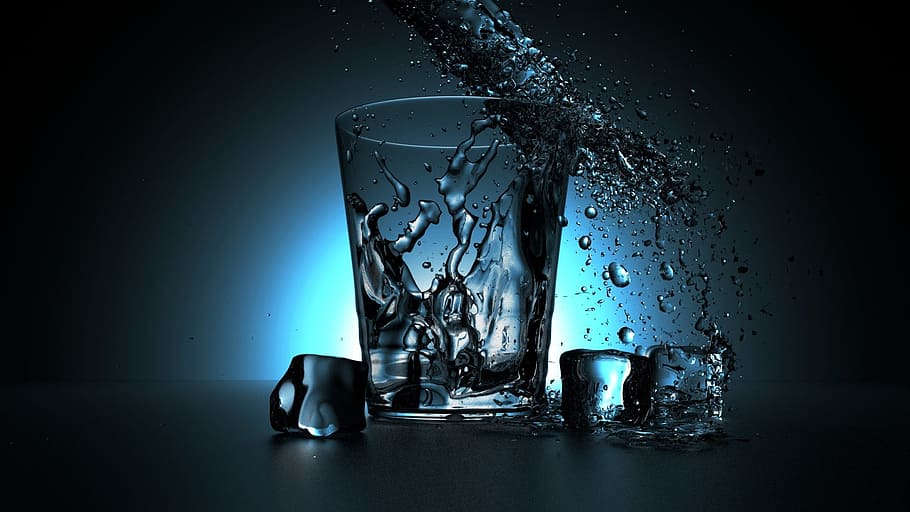 Glass of water. Glass of cold water with splash and dew drops