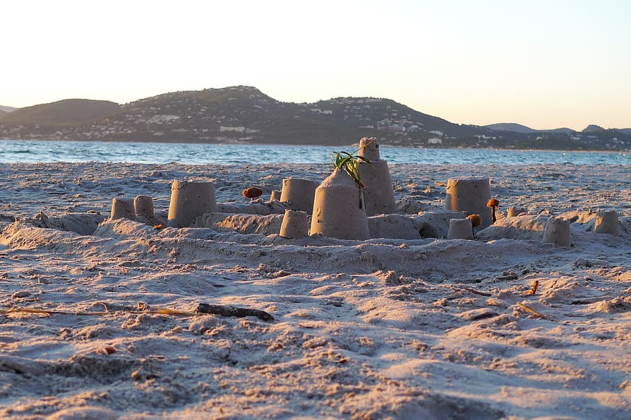 sand castle, beach, sea, water, sky, mountain, land, nature HD wallpaper