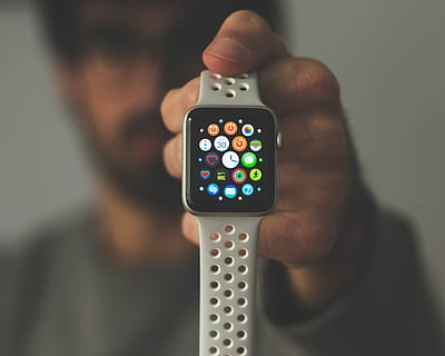 person holding silver aluminum case Apple Watch, turned-on silver aluminum case Apple Watch with Nike Sport Band HD wallpaper