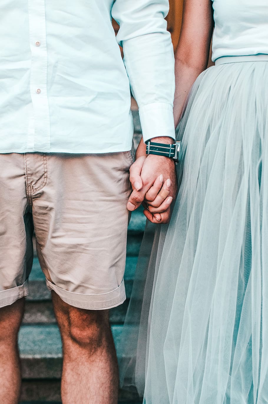 man and woman holding hands while standing, couple holding hands on stairs HD wallpaper