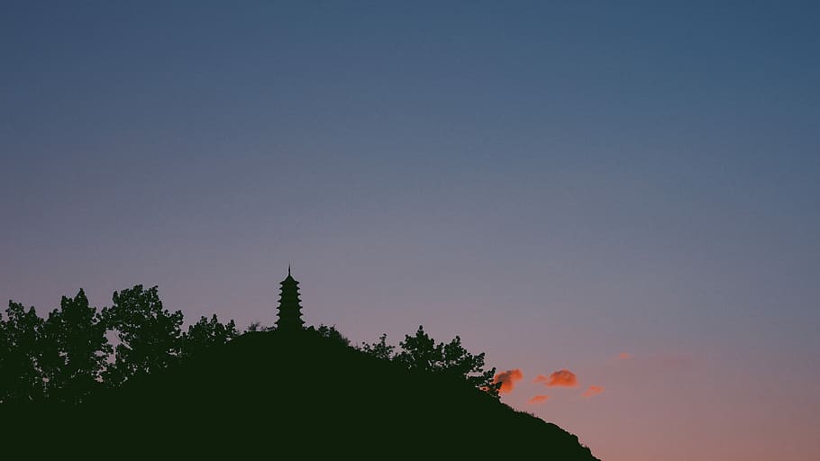 silhouette of mountain with building, pagoda temple on hill at golden hour HD wallpaper