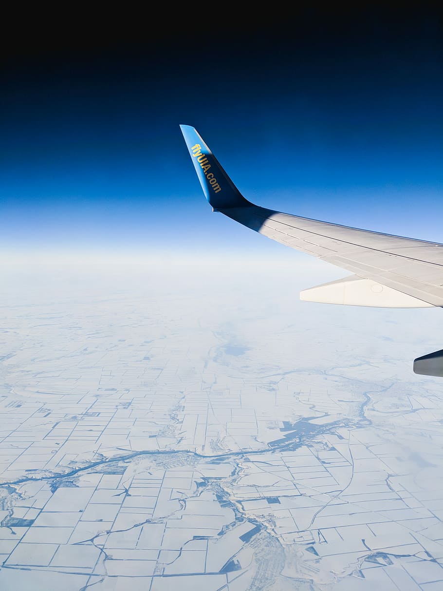 aerial photography of white and blue airplane, white and blue aircraft wing HD wallpaper