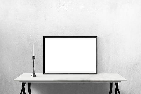 rectangular white board with black wooden frame on top of white wooden console table HD wallpaper