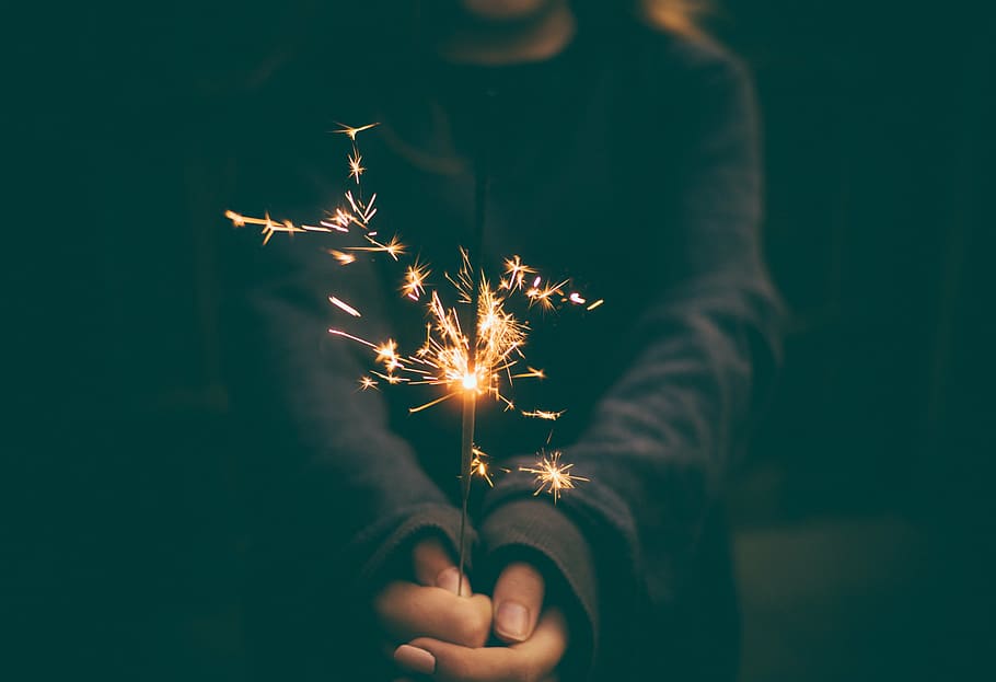 person's hand holding fireworks, celebrate, celebration, flame HD wallpaper