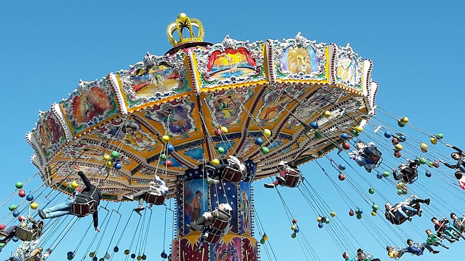 yellow and blue arcade ride, chain carousel, oktoberfest, spring festival
