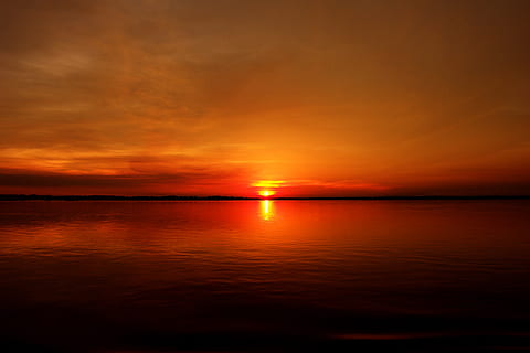 silhouette photography of body of water during golden hour HD wallpaper