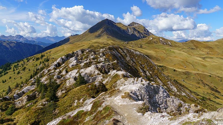 aerial photography of mountain range under cumulus clouds, trail HD wallpaper