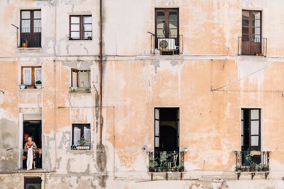 minimalist photography of open windows and doors of building terraces, brown apartment-type house HD wallpaper
