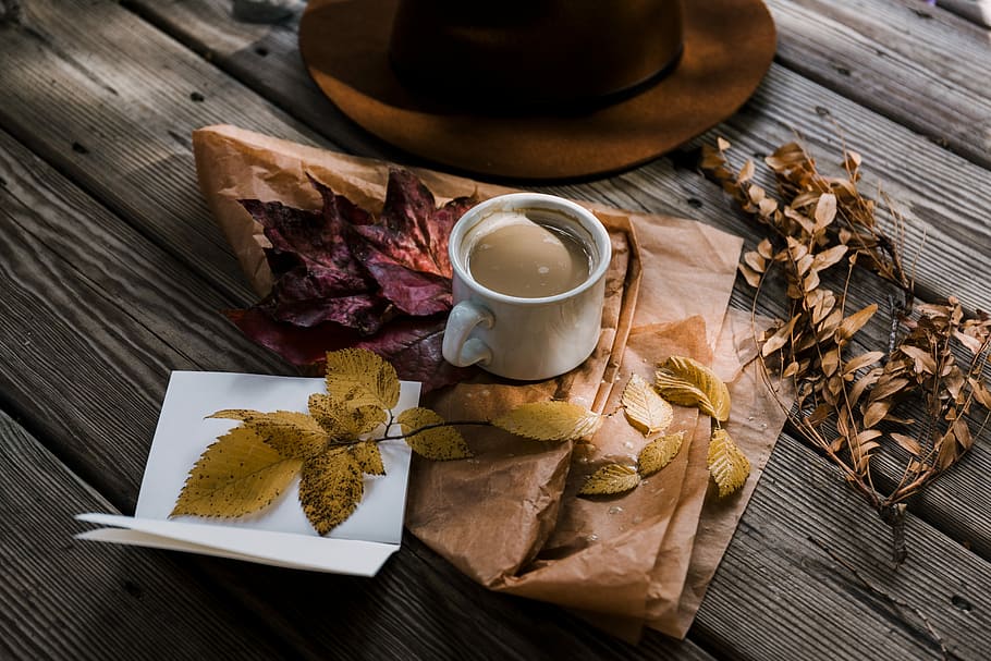 full filled coffee white ceramic mug beside brown hat, white mug filled with brown liquid HD wallpaper