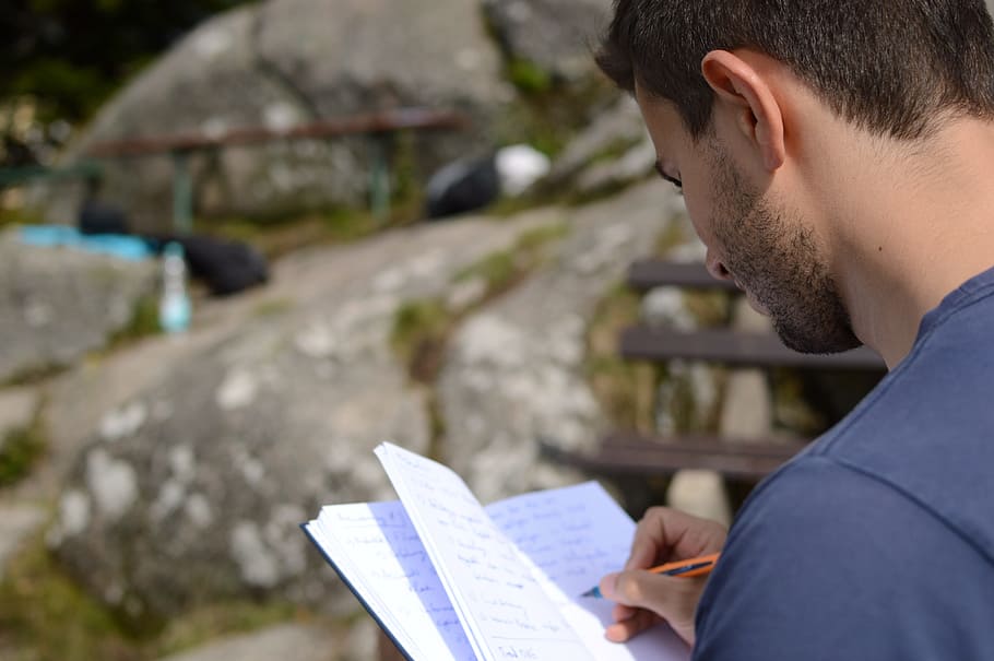 person holding notebook while writing at daytime, idea, notes HD wallpaper