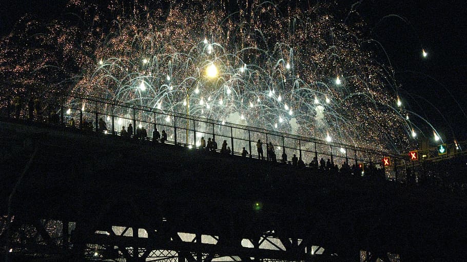 photo of firework displays during night time, people on bridge watching firework display HD wallpaper