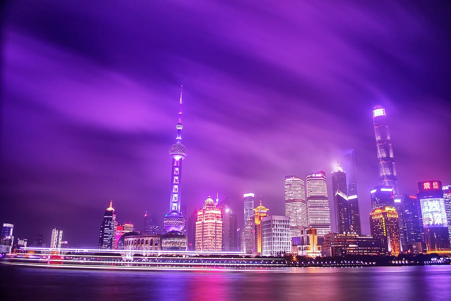 cityscape of high rise buildings, city buildings under purple sky