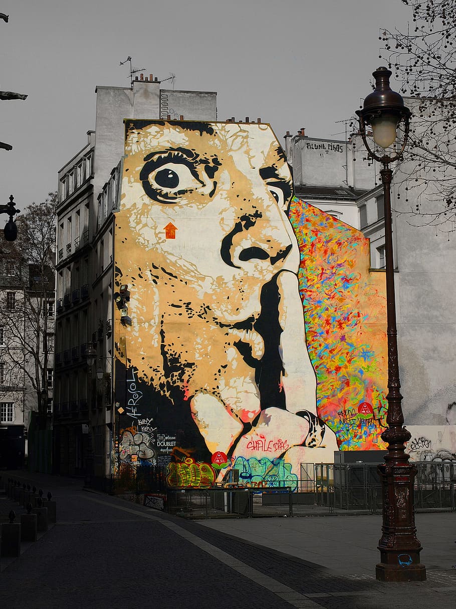 selective color photography of man's face graffiti, wall, artwork