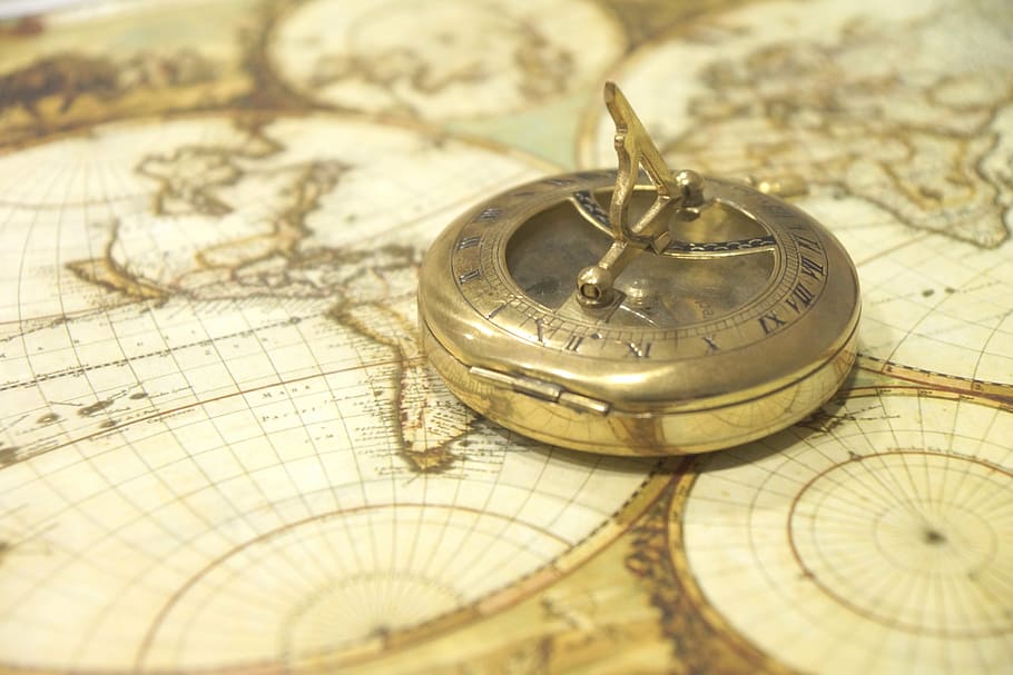 gray steel compass on map closeup phot, map of the world, antique