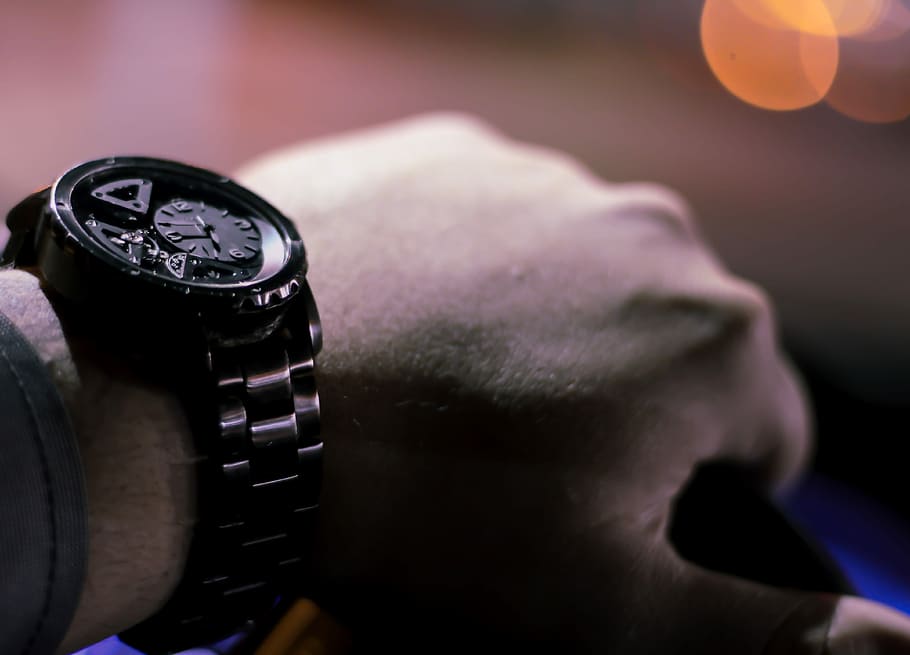 selective photo of person holding vehicle steering wheel, person wearing round black chronograph watch with link bracelet HD wallpaper