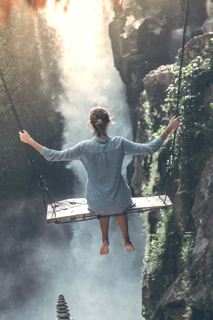 woman riding on wooden swing, woman sitting on swing, person