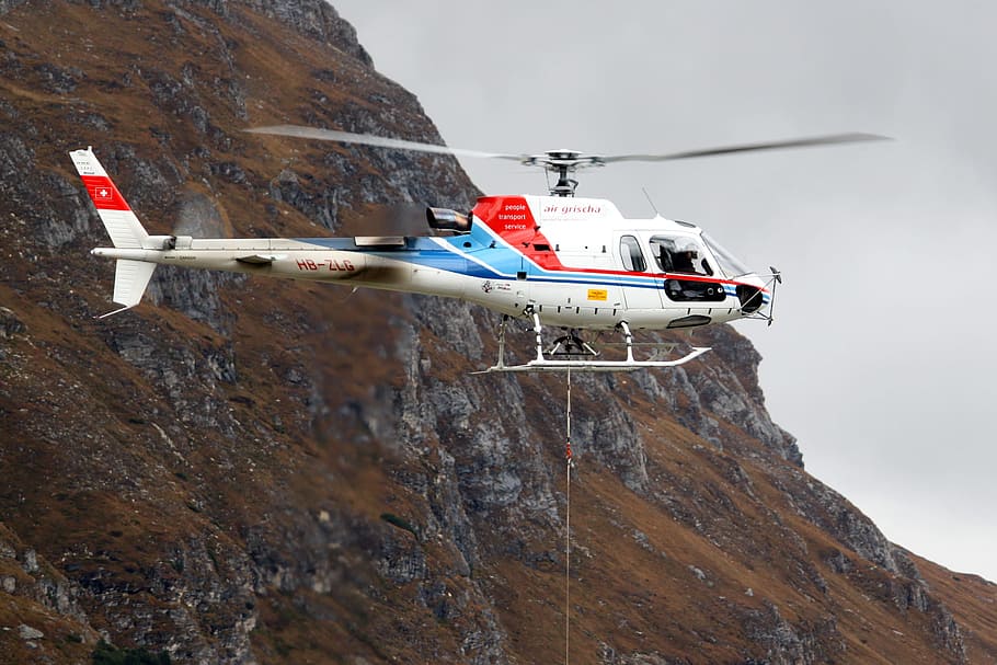 white and red helicopter flying near mountain terrain during daytime, helicopter hovering near mountain, HD wallpaper