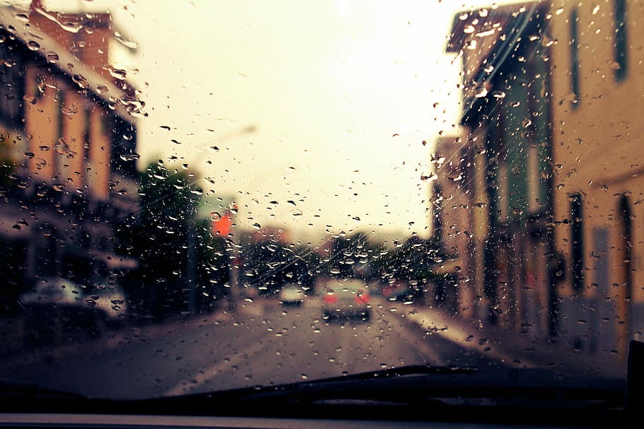 inside vehicle view of other vehicle on road between buildings HD wallpaper