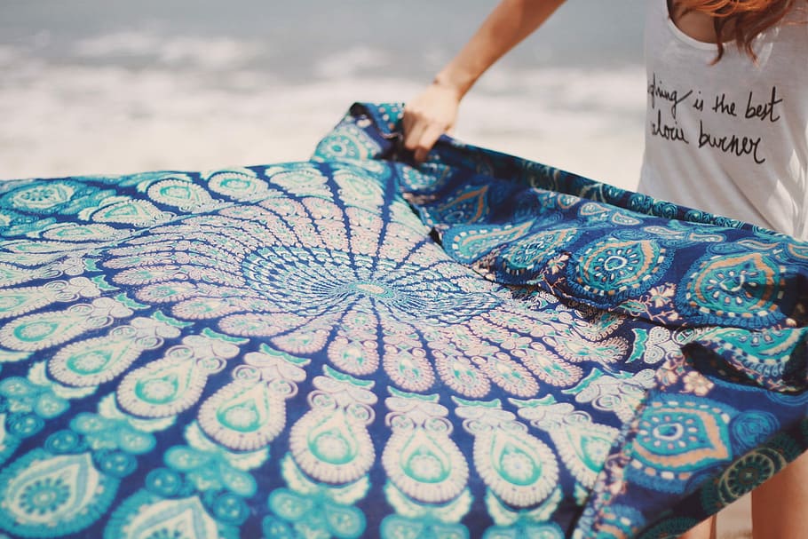 person holding blue floral textile, outdoors, color Image, human body part HD wallpaper