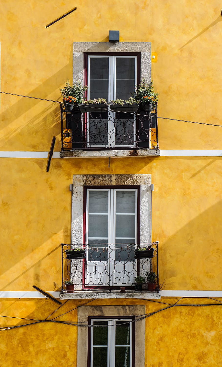 white wooden window panels and yellow painted wall, orange painted building with three storey window panels HD wallpaper