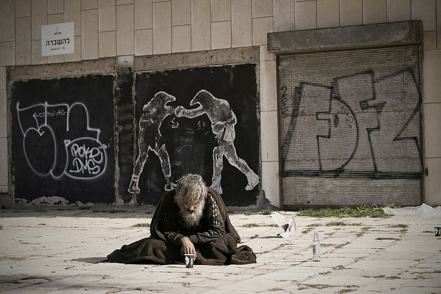 man in black top sitting on floor, homeless, street, art, reality