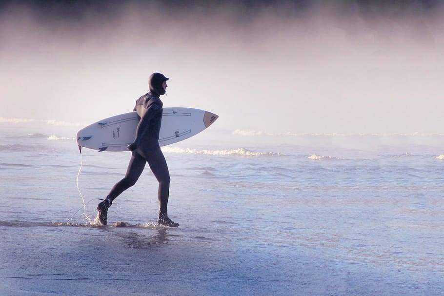 man holds surfboard at sea, surfer, action, beach, waters, head HD wallpaper