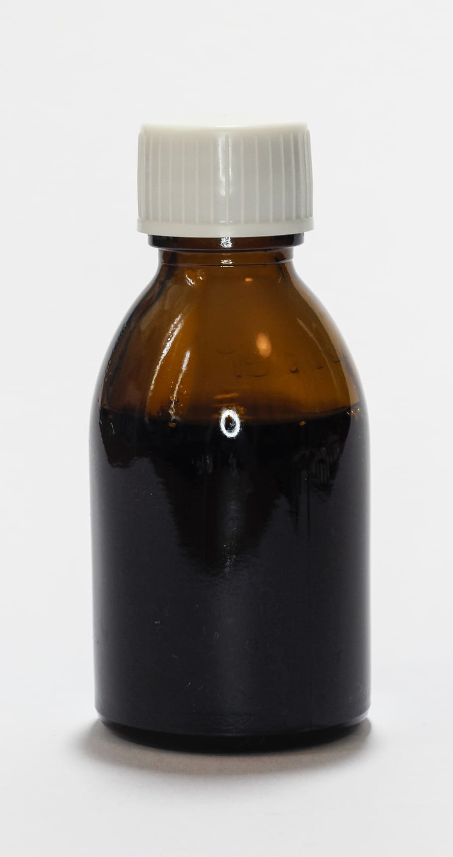 closed amber bottle with white lid, medications, cure, the syrup