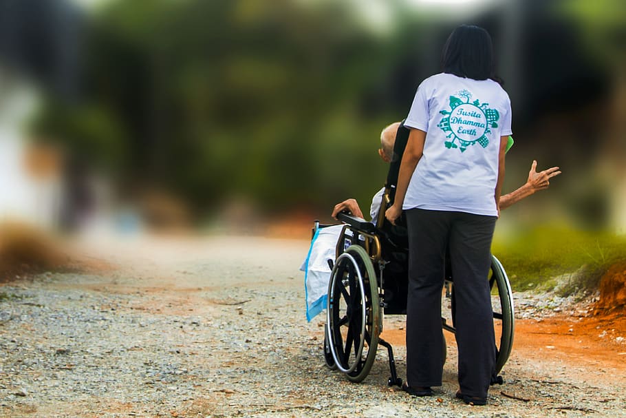 hospice, pushing wheel chair, disabled, elderly, handicap, nursing