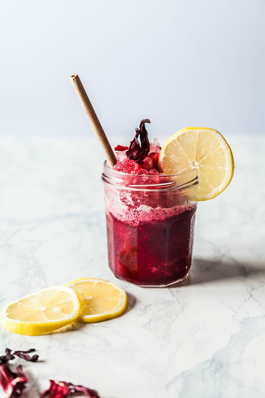 strawberry juice with sliced oranges, fruit drink with lemon slice and cinnamon stick HD wallpaper