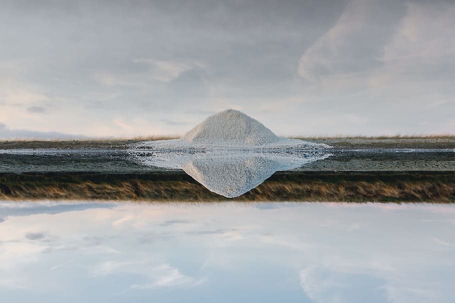 white and gray field near body of water, body of water with reflection of white piled sands HD wallpaper