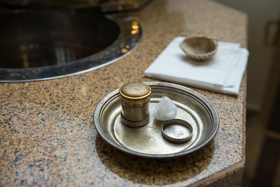 round stainless steel tray with round brown container, baptism HD wallpaper
