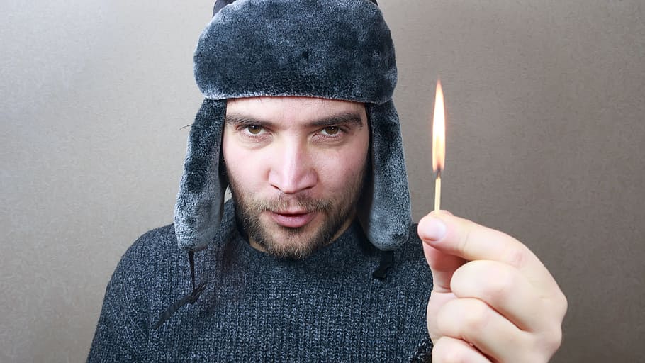 man holding safety match, winter, cap, cold, white, young, background HD wallpaper