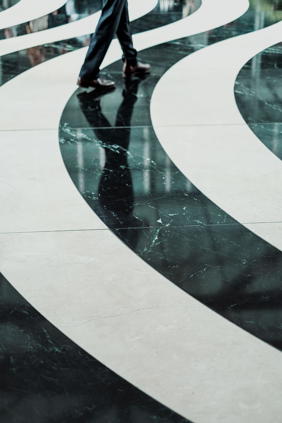 Swirling black and white pattern on a marble floor, person wearing black pants walking on white and black ceramic flooring, HD wallpaper