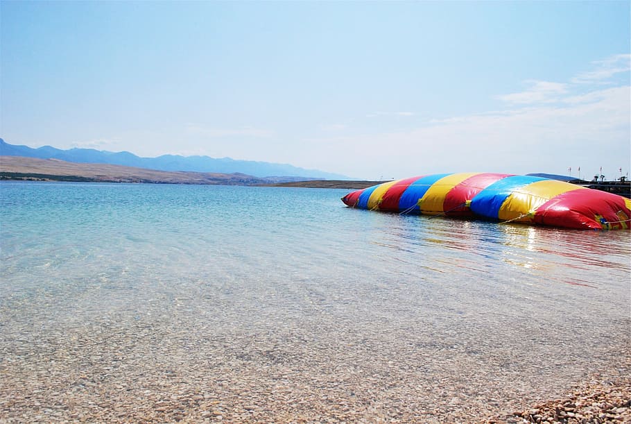 beach, rocks, water, shore, inflatable bouncer, sunshine, multi colored HD wallpaper
