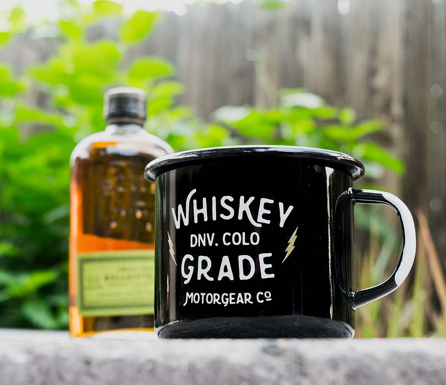 close-up photo of black and white Whiskey DNV. Cold Grade Motor Gear Co. mug, black and white ceramic mug on gray concrete surface HD wallpaper