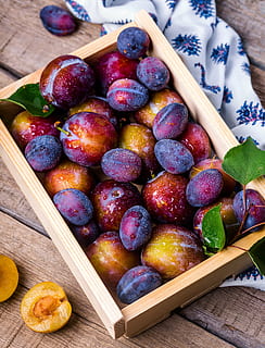 round fruits on brown wooden box, plum, summer, still life HD wallpaper