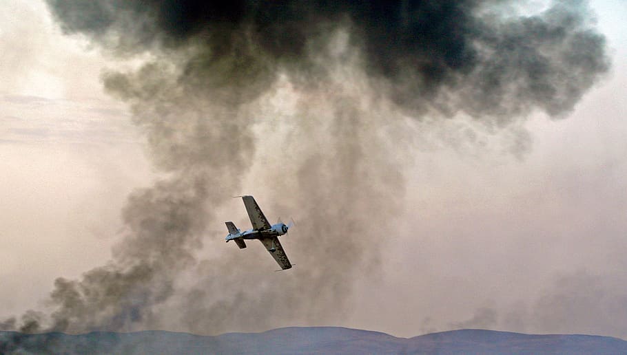 panning photography of flying blue and white biplane, biplane on mid air HD wallpaper