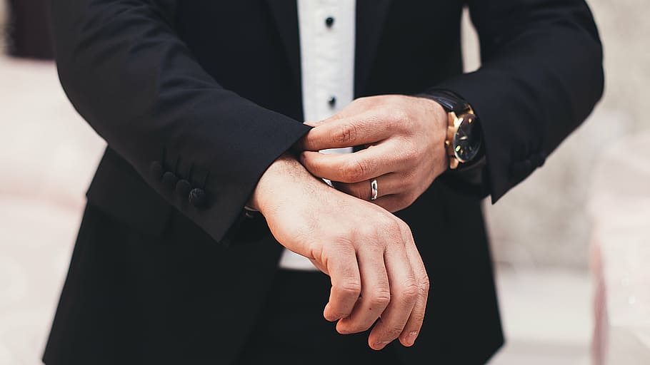 selective focus photography of person in black shirt folding sleeve HD wallpaper