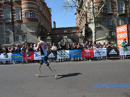 man with prosthetic legs running on road, persistence, courage HD wallpaper