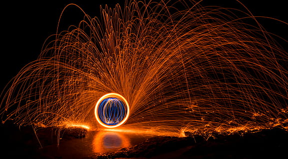 steel wool photography, sphere in middle of lava shower wallpaper HD wallpaper