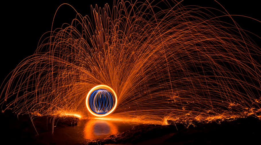 steel wool photography, sphere in middle of lava shower wallpaper HD wallpaper