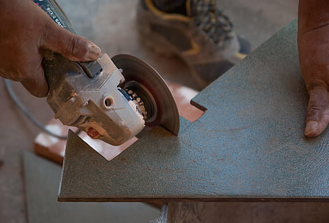 person holding angle grinder cutting tile, tiler, worker, site HD wallpaper