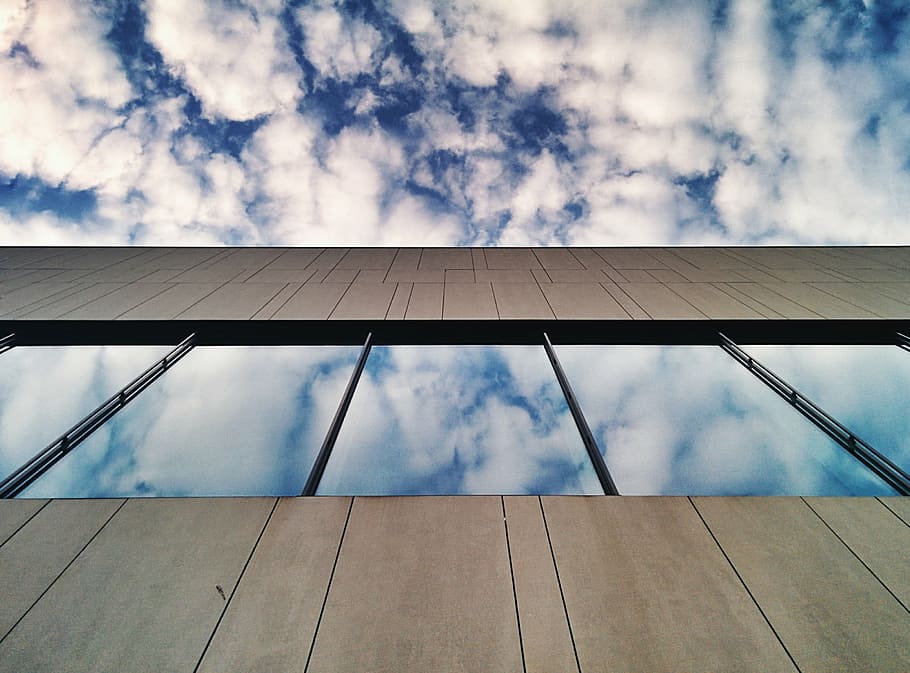 low-angle photography of high-rise building, brown, blue, cloudy HD wallpaper