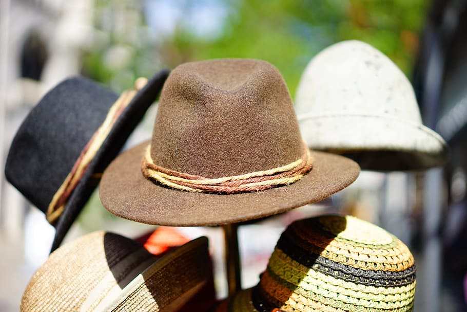 selective focus photography of fedora hats on rack, felt, hat manufacture HD wallpaper