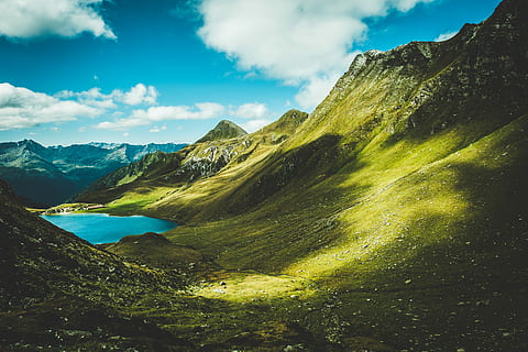 green mountain near lake at daytime, photography of green mountains under clear blue sky during daytime HD wallpaper