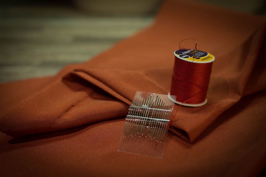 thread spool beside needles on textile, fabric, sewing, needlework HD wallpaper