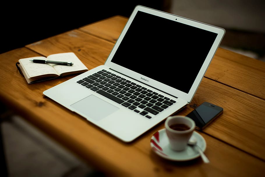 turned-off MacBook Air on brown wooden surface, ceramic, mug HD wallpaper